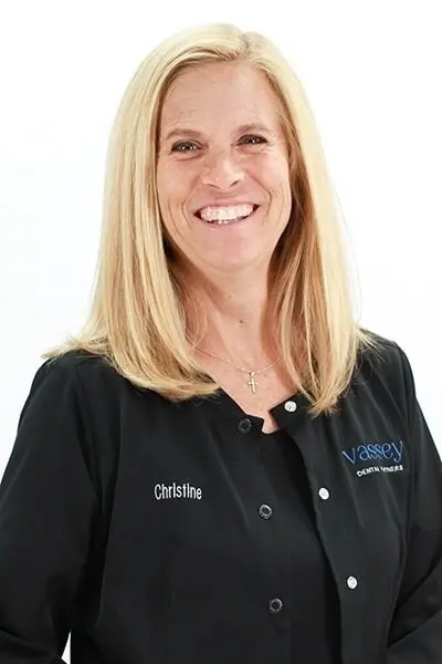 Christine, dental team member at Peachtree City practice, smiling in professional portrait.