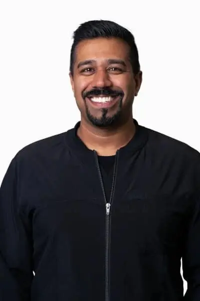 Dr. Amish N, dentist at Peachtree City dental practice, smiling professionally.