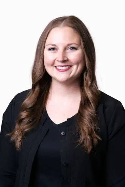 Dr. Christine K, dentist at Peachtree City dental practice, smiling in professional portrait.