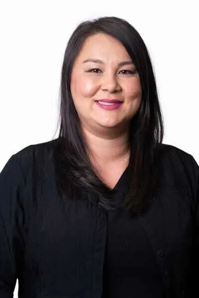 Dr. Michelle K, dentist at Peachtree City dental practice, smiling in professional portrait.