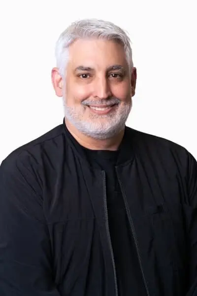 Dr. Neal M, dentist at Peachtree City dental practice, smiling in professional headshot.