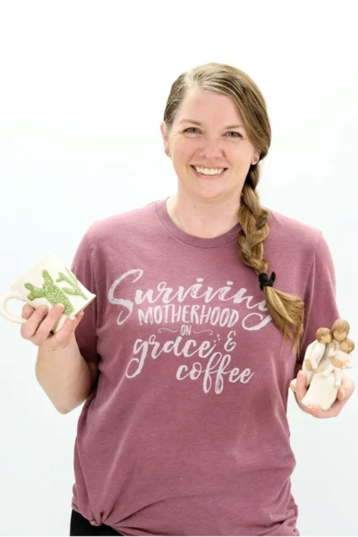 Smiling dental team member holding mushrooms and vegetables in Peachtree City.