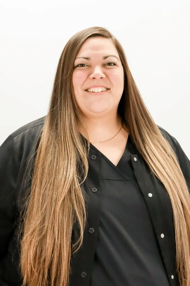 Jennifer P, dental team member at Peachtree City dental practice, smiling portrait.