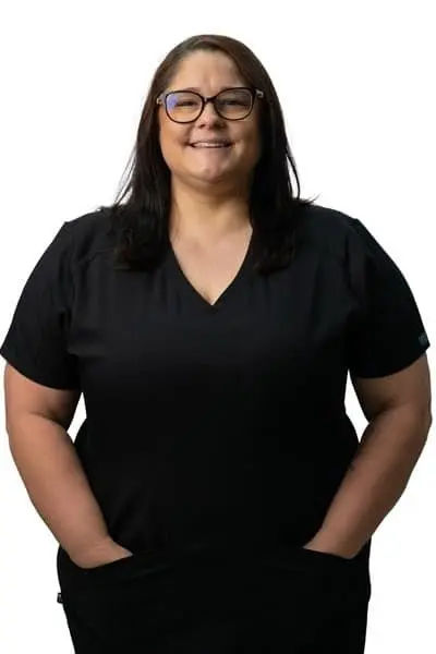 Missy P, dental team member at Peachtree City dental practice, smiling at camera.