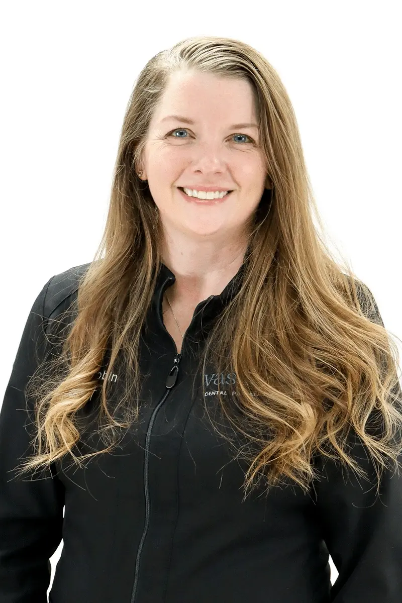 Robin, dental professional at Peachtree City dental practice, smiling at camera.