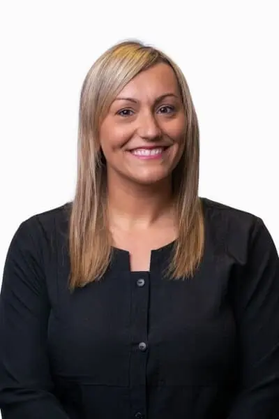 Tricia R, dental team member at Peachtree City dental practice, smiling portrait.