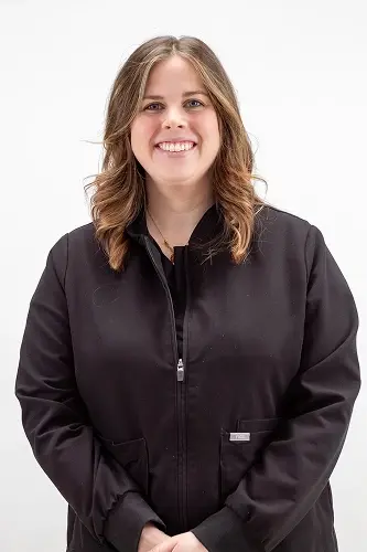 Lindsay S., dental team member at Peachtree City dental practice, smiling in professional portrait.
