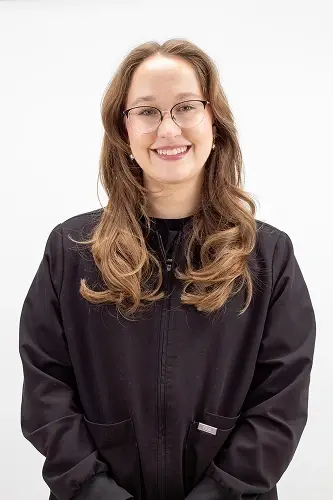 Rachel A, dental team member at Peachtree City dental practice, smiling in professional portrait.
